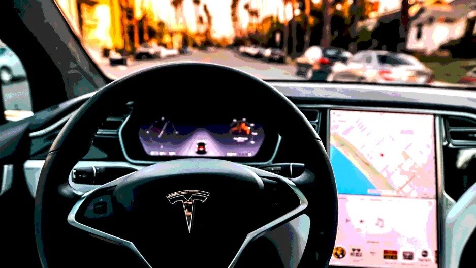 Tesla’s autopilot is letting people drive hands-free. Regulators are asking questions
